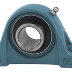 Mounted pillow block bearing with housing