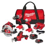 A complete Milwaukee power tool set including a drill, impact driver, circular saw, sawzall, two batteries, charger, and a carrying bag.