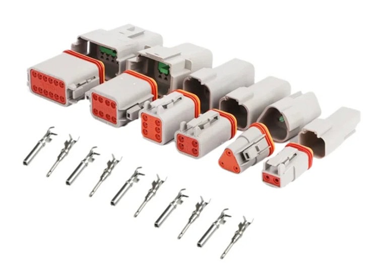 Various sizes of Deutsch connectors and their corresponding pins.