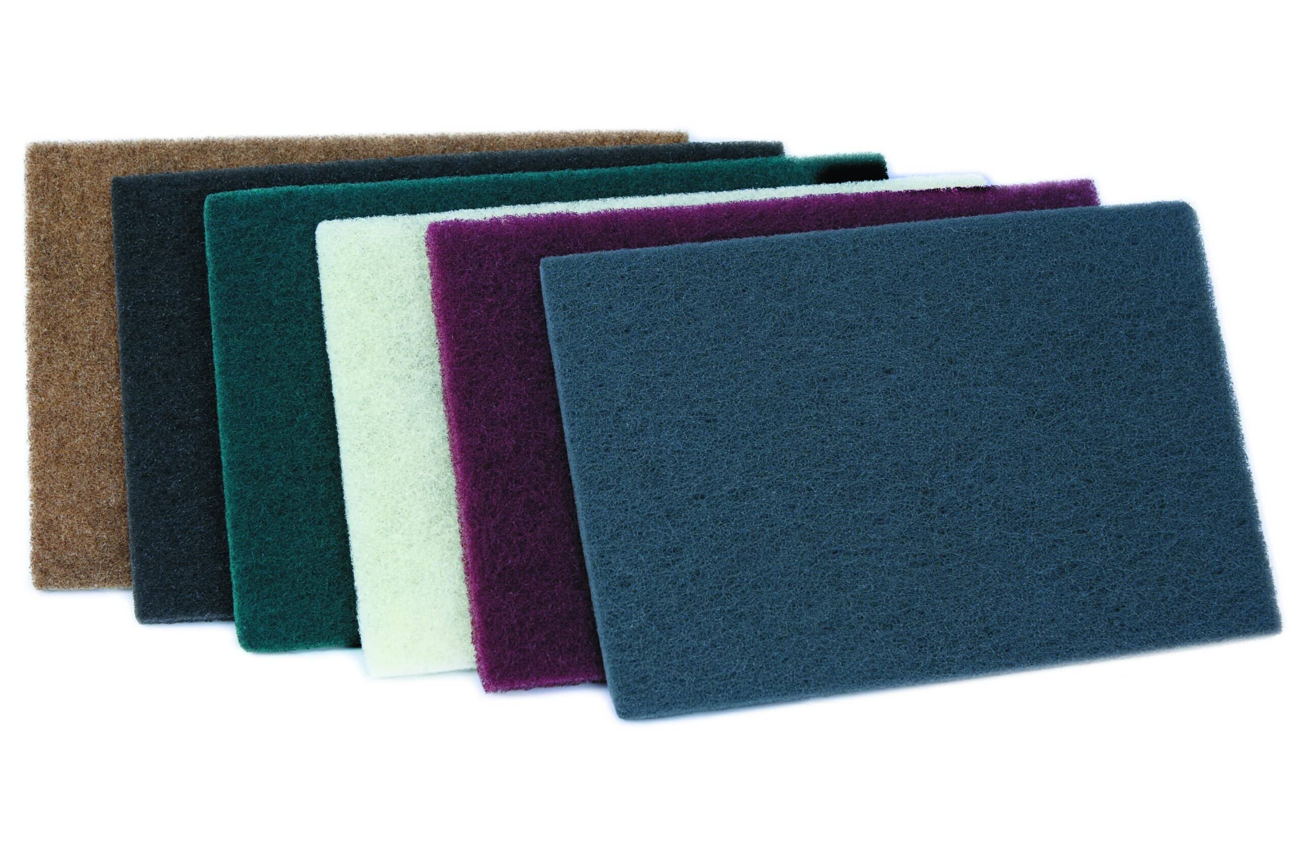 Set of premium non-woven industrial hand pads in various colors for cleaning and polishing.